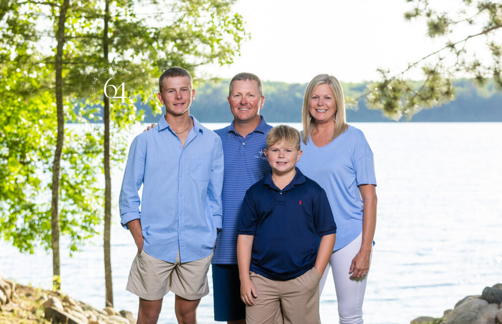 Family of Four Portrait in front of a Lake in Minnesota during summertime.