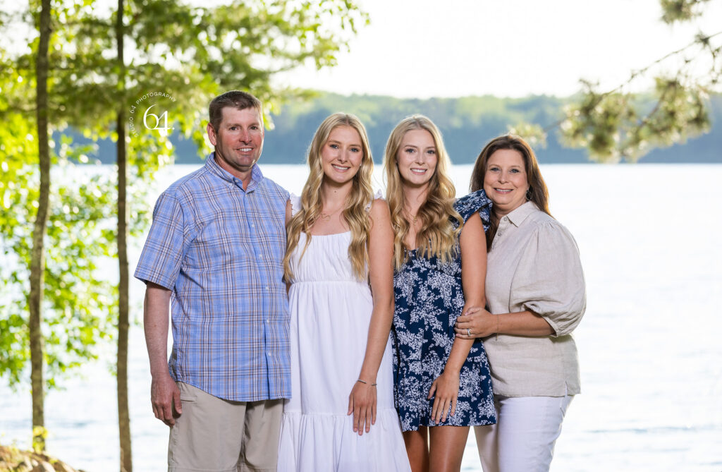 Family of Four Portrait in front of a Lake in Minnesota during summertime.