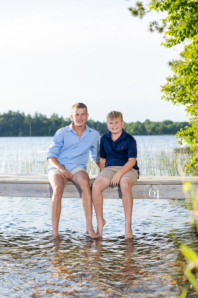 Portrait of Two Brothers in front of a Lake in Minnesota during summertime.