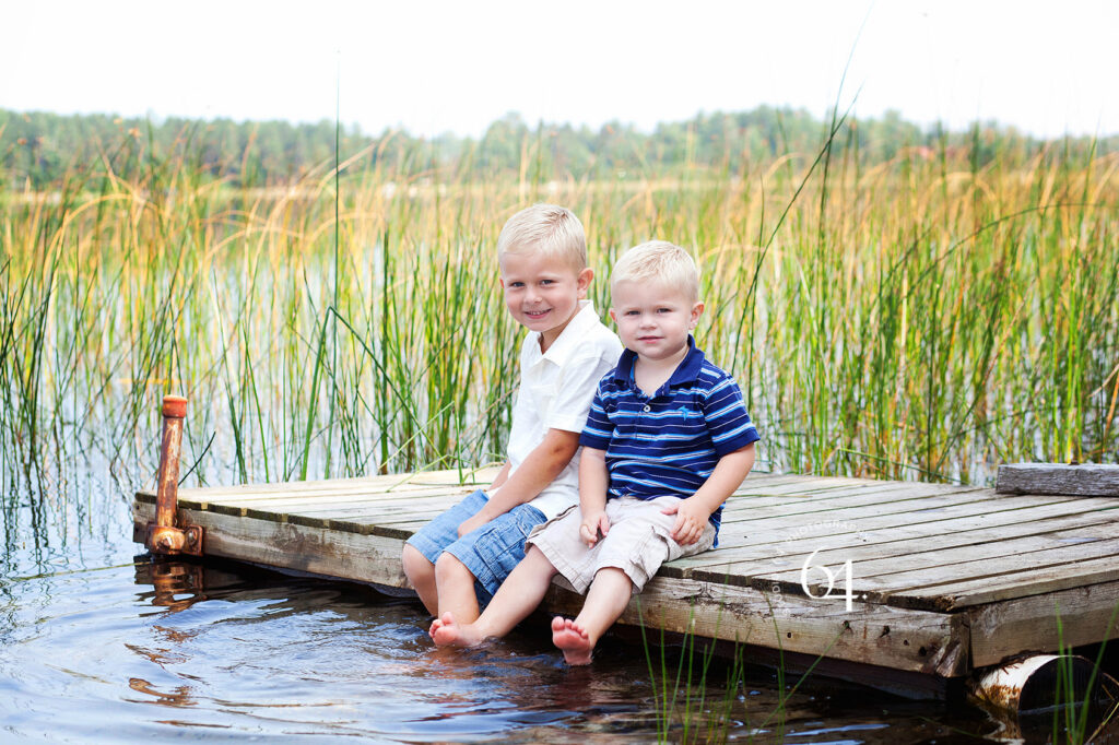 Portrait of Brothers in front of a Lake in Minnesota during summertime.