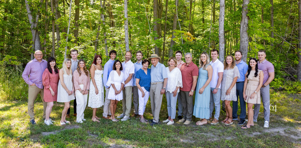 Large Extended Family outdoor portrait a summer forest backdrop.